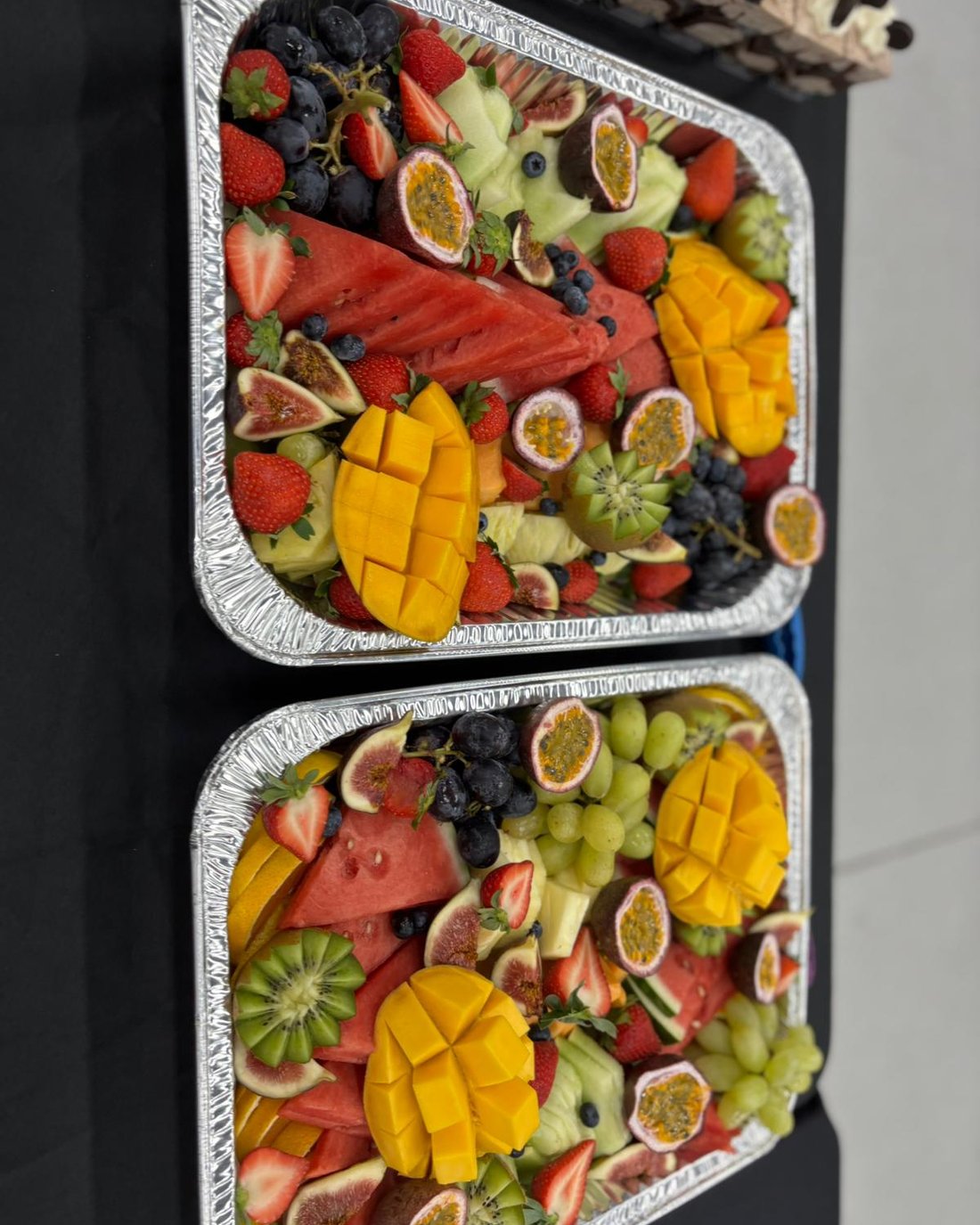 Fresh fruit platters with mango, kiwifruit and passionfruit