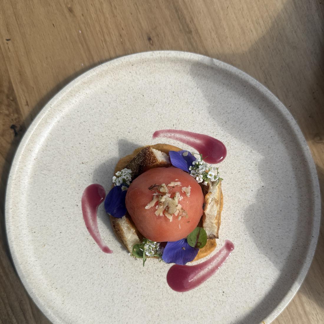 Plated fine-dining starter with edible flowers