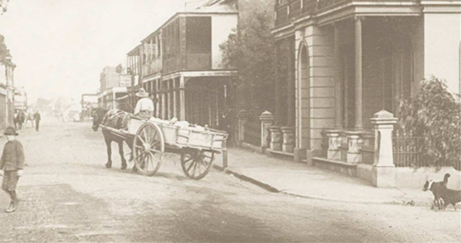 Historic sepia photograph of Macquarie Street, Windsor, with a horse and cart